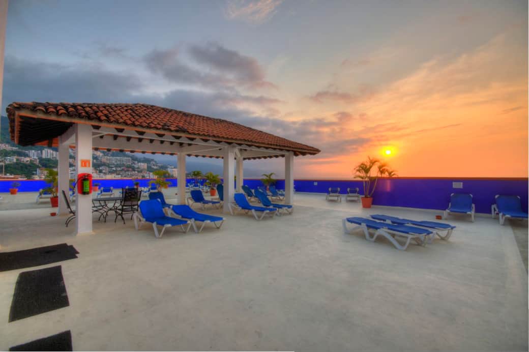 Rooftop swimming pool and lounge chairs